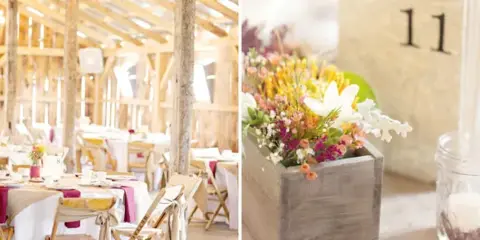 Interior view of a rustic barn wedding venue featuring exposed wooden beams, chandeliers, and set dining tables with white linens and wooden chairs.