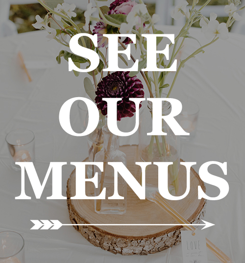 A wedding table setting featuring a floral centerpiece on a wooden slice and a 'LOVE' tag, with a 'SEE OUR MENUS' text overlay.