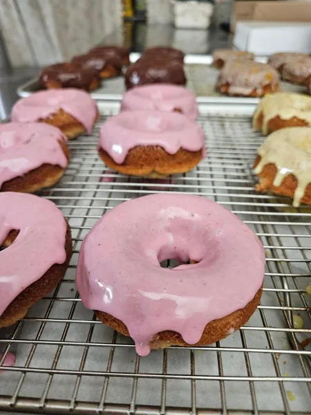 Glazed baked donuts on a wire cooling rack