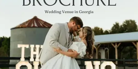 A bride and groom dancing in front of a white barn and pavilion at The 1788 Ranch wedding venue.