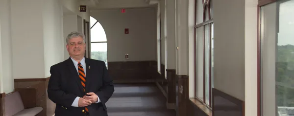 Sangamon County Circuit Clerk Paul Palazzolo standing in the hallway of the Sangamon County Courts Complex.