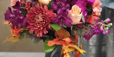 Fall flower arrangement by Genesee Valley Florist