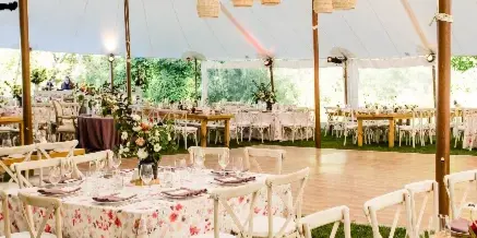 Tuscan farm table event setup by Rain or Shine Tent Company