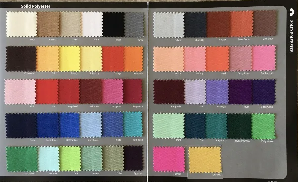 A fabric swatch book displaying a wide variety of solid polyester linen colors and textures.