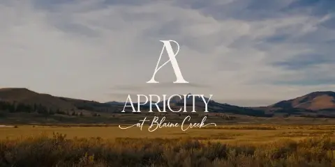 Wide landscape of golden grassland and rolling hills under a cloudy sky with the Apricity at Blaine Creek logo overlaid.