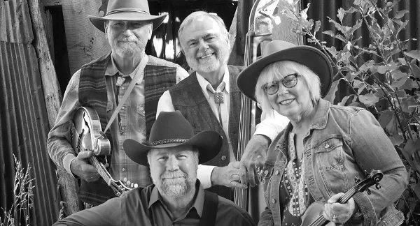 A black and white group portrait of four musicians holding a mandolin, upright bass, and fiddle.