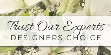 A white floral arrangement featuring lilies and roses with the text 'Trust Our Experts Designers Choice'.