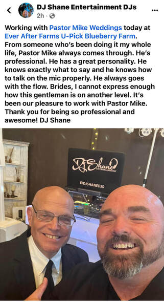 Pastor Mike Weddings officiant posing with a DJ at a wedding venue.