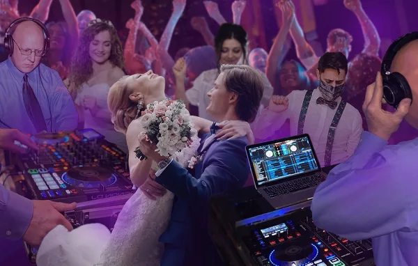 A DJ wearing headphones operates a mixing console and laptop while a bride and groom dance at a wedding reception.