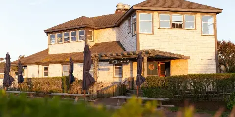 Exterior of Millie's Nantucket restaurant with outdoor patio tables and umbrellas