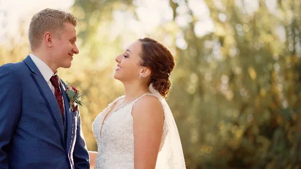 A bride and groom looking at each other during a wedding ceremony.