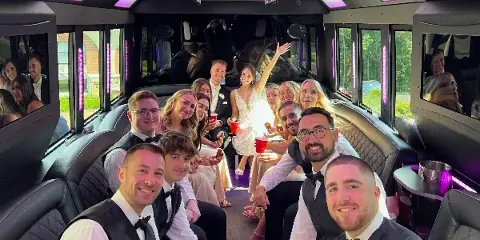 Sterling Limousine - wedding party in a limo bus