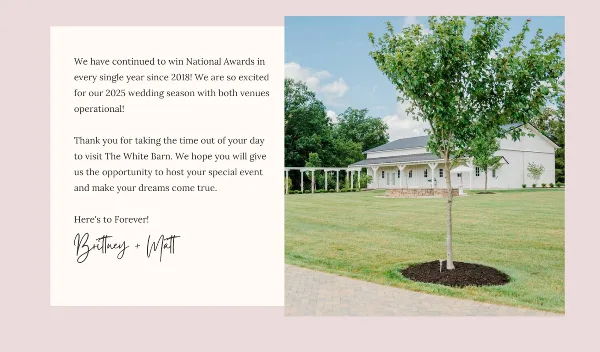 Exterior view of a white barn wedding venue with a covered patio, lawn, and trees.