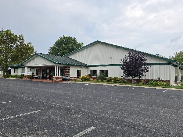Exterior view of the Tipton County Event Center building with a large parking lot in the foreground.