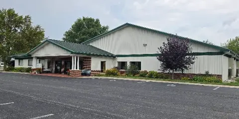 Exterior view of the Tipton County Event Center building with a large parking lot in the foreground.