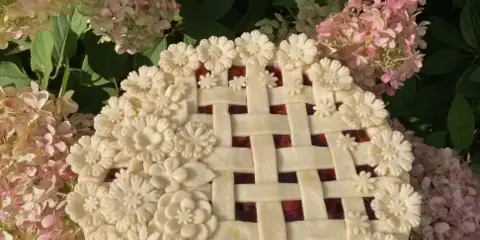 A berry pie with a lattice top and hand-cut pie-crust florals, baked by Birdie's Baking Co. in Columbia City, Indiana