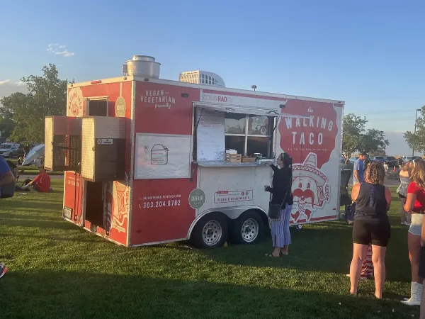 The Walking Taco food truck serving customers at an outdoor event