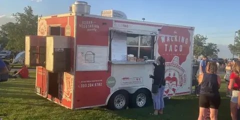 The Walking Taco food truck serving customers at an outdoor event
