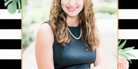 Professional portrait of Kara Cardinal, founder of KC Weddings & Events, wearing a black sleeveless dress and pearl necklace.