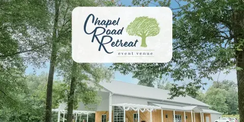 Exterior view of the Chapel Road Retreat event venue building featuring a covered patio and wooden facade.
