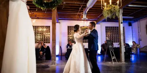 Bride and Groom Dancing with Uplighting in background