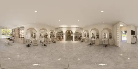Interior view of a modern beauty salon and spa with manicure stations and product displays.
