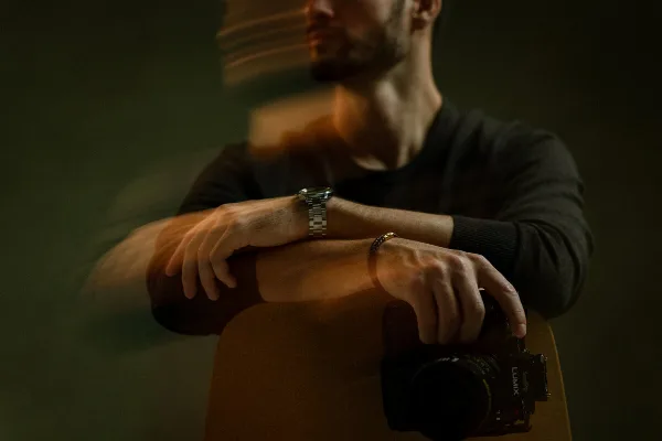 A videographer holding a professional camera