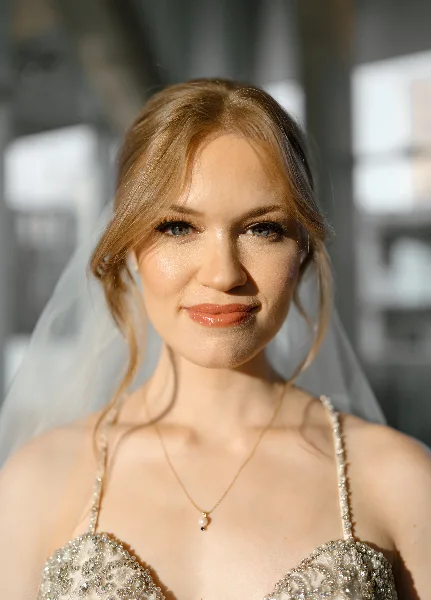 Portrait of a bride with styled hair, veil, and full makeup