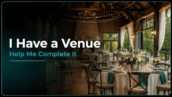 A rustic event venue interior featuring round tables with white linens, wooden chairs, and floral centerpieces under string lights.