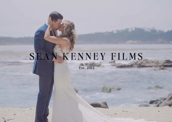 A bride and groom sharing a kiss on a beach, with the text 'SEAN KENNEY FILMS Est. 2012' overlaid.