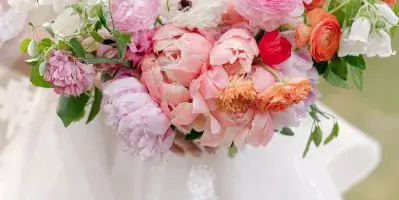 Bridal bouquet with coral and blush garden roses
