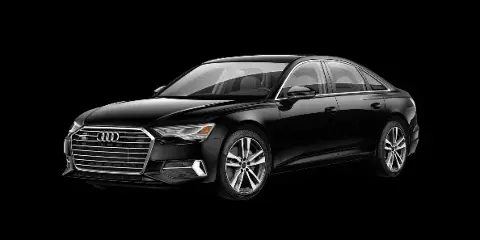 A black Audi A6 sedan shown in a three-quarter front view against a dark background.