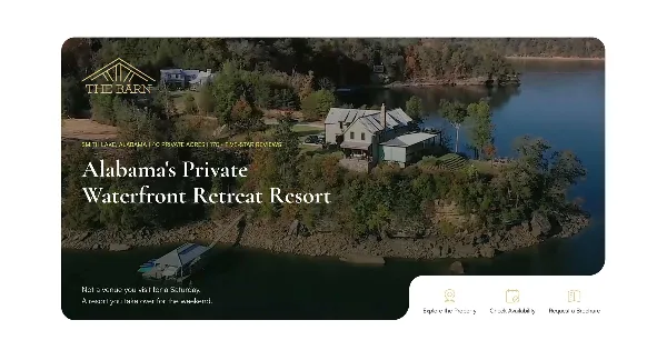 Aerial view of a private waterfront resort featuring multiple lakefront buildings, a dock, and surrounding wooded property on a large lake.