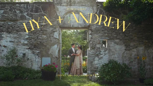 Cinematic wedding film title card showing a couple standing in a stone archway with the text 'LIYA + ANDREW'.