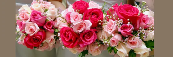 Three floral bouquets featuring pink and red roses with greenery and filler flowers.
