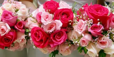 Three floral bouquets featuring pink and red roses with greenery and filler flowers.