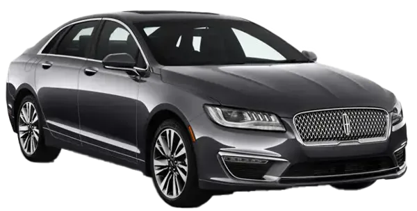 A dark gray Lincoln sedan viewed from the front three-quarter angle, featuring a chrome grille and alloy wheels.