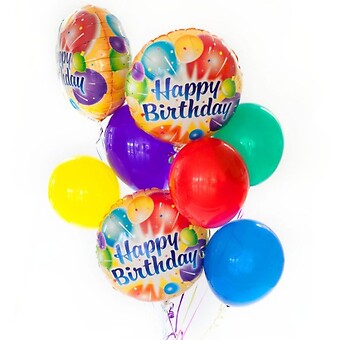 A colorful balloon bouquet featuring 'Happy Birthday' printed balloons and solid-colored latex balloons.
