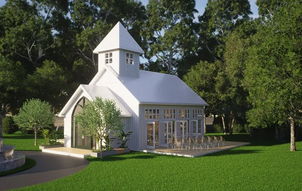 Architectural rendering of a white wedding chapel with a steeple and large windows, situated in a wooded area with a paved patio and chairs.