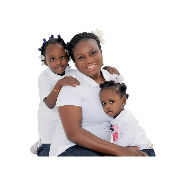 A professional studio portrait of a mother holding two young children against a white background.