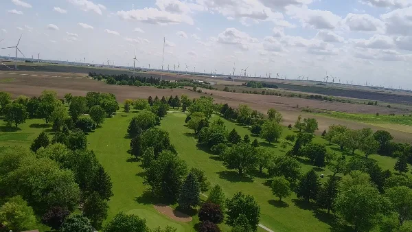 Aerial view of the Benton County Golf Course fairways and trees in Fowler, Indiana.