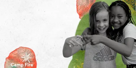 Two smiling children making a heart shape with their hands in front of a colorful background with the Camp Fire logo.