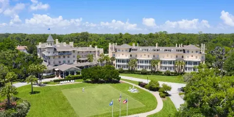 Aerial view of the Jekyll Island Club Resort clubhouse and manicured grounds