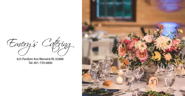 A professionally set catering table featuring a floral centerpiece, glassware, and plated food, with the Emery's Catering logo and contact information on the left.