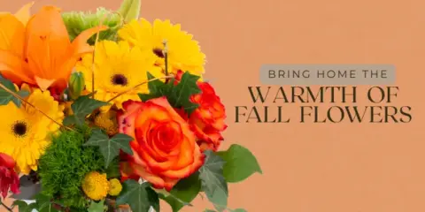 A close-up of a colorful floral arrangement with orange lilies, yellow daisies, and red roses.