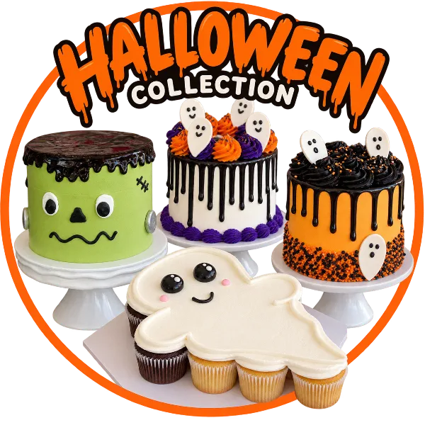 A display of Halloween-themed cakes and cupcakes, including a Frankenstein cake and ghost-shaped cupcakes.