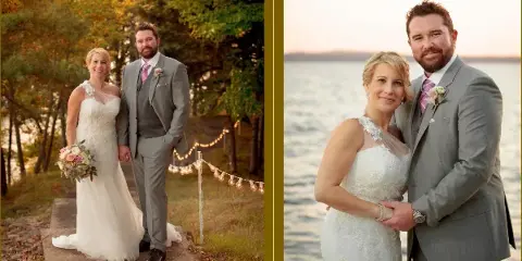A bride in a white lace gown holding a bouquet and a groom in a gray suit posing outdoors near a lake.