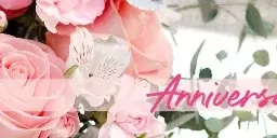 A close-up photograph of a floral arrangement featuring pink roses, lilies, and eucalyptus leaves.