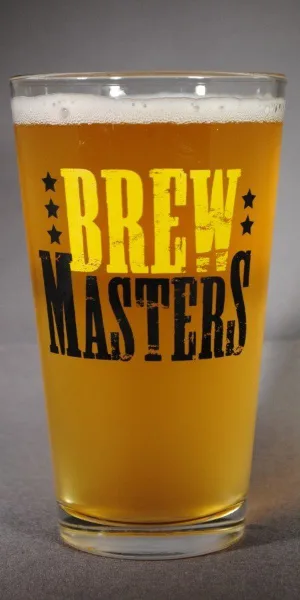 A pint glass of golden beer with the Brewmasters logo printed on the side.
