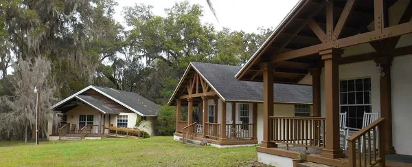 Exterior view of the wooden cottages and grounds at Chinsegut Hill Retreat and Conference Center.
